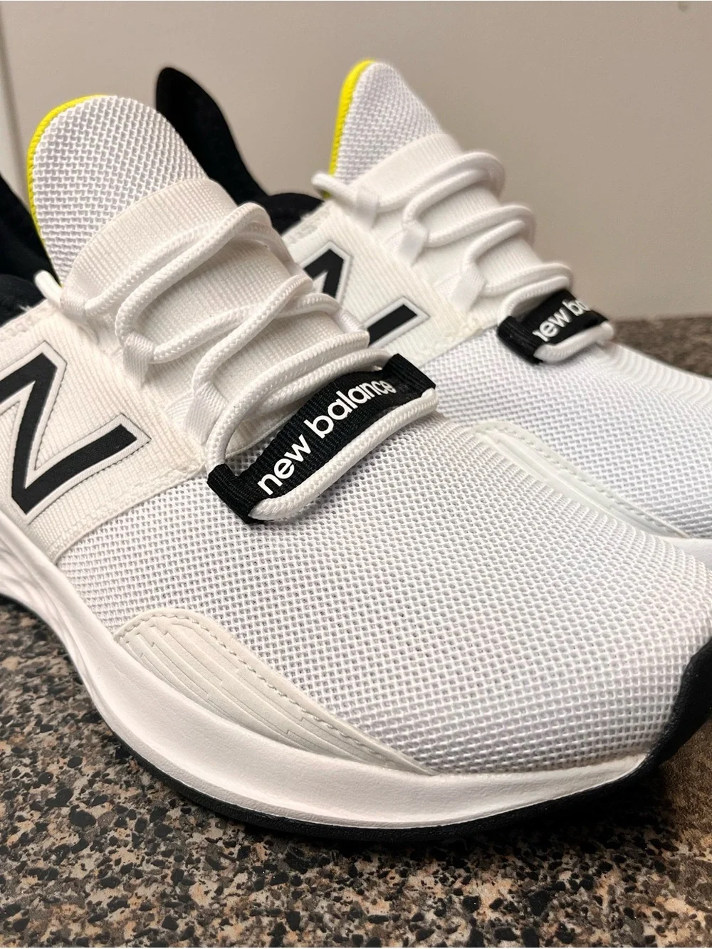 New Balance White Black Athletic Running Shoes with Yellow Accent
